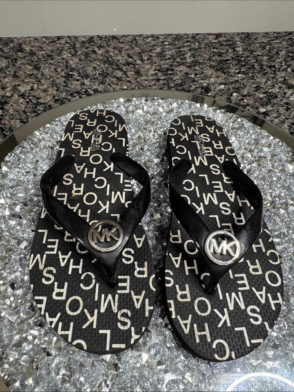 Michael Kors Black Logo Flip Flop Sandals with Silver MK Medallions EUC 7.5